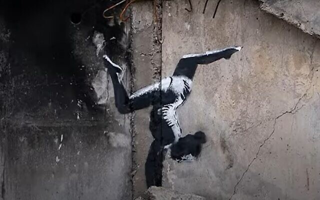 Banksy mural on bombed-out building in Borodyanka, Ukraine, November 2022 (Screen grab/YouTube)