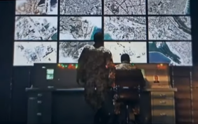 A screengrab from a video posted on October 31, 2022, to the IRGC's Telegram channel shows what seems to be Iranian soldiers in front of screens displaying satellite images of Israeli and American bases in the Middle East. (The Middle East Media Research Institute)
