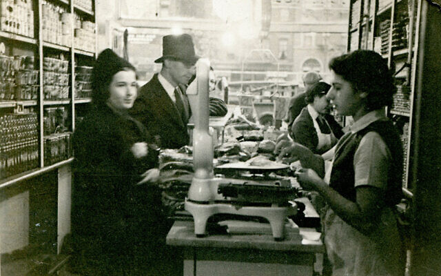 Mark Russ Federman's mother, Anne, serves customers at Russ and Daughters in 1939. (From the collection of Russ & Daughters/ via the New-York
Historical Society)