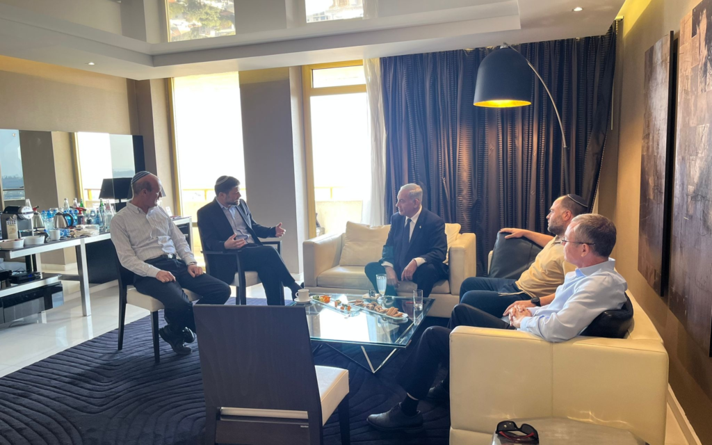 Likud head Benjamin Netanyahu (center) speaks with Religious Zionism chief Bezalel Smotrich (second from left) during informal coalition talks in Jerusalem on November 6, 2022. (Courtesy)