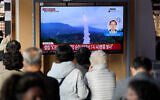 A TV screen showing a news program reporting about North Korea's missile launch with file footage is seen at the Seoul Railway Station in Seoul, South Korea, November 3, 2022. (AP Photo/Lee Jin-man)