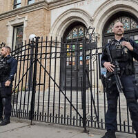 Hoboken Police officers stand watch outside the United Synagogue of Hoboken, in Hoboken, New Jersey, Nov. 3, 2022. (AP Photo/Ryan Kryska)
