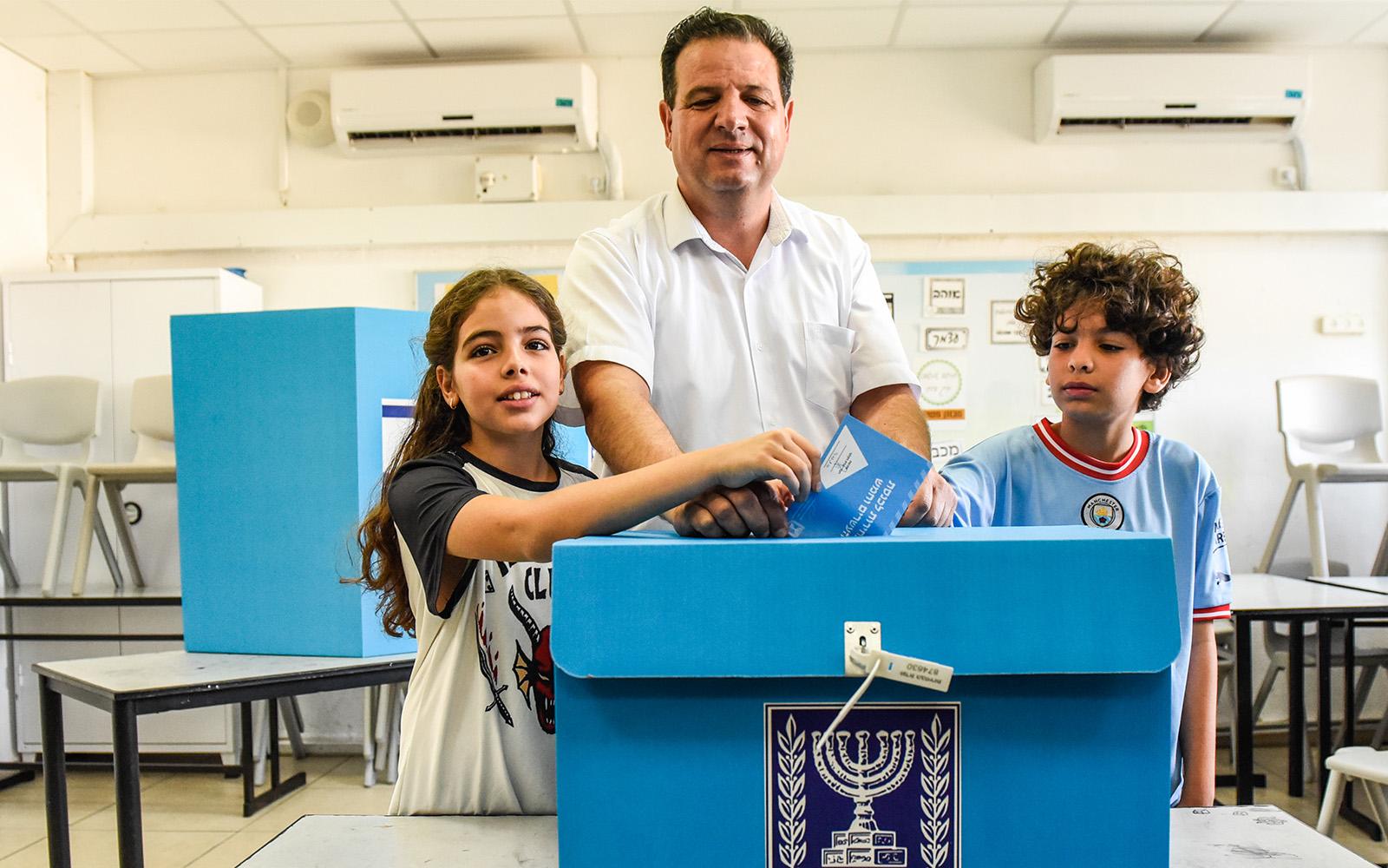 Hadash-Ta’al leader Ayman Odeh casts his ballot at a voting station in Hafia, on November 1, 2022. (Roni Ofer/Flash90)