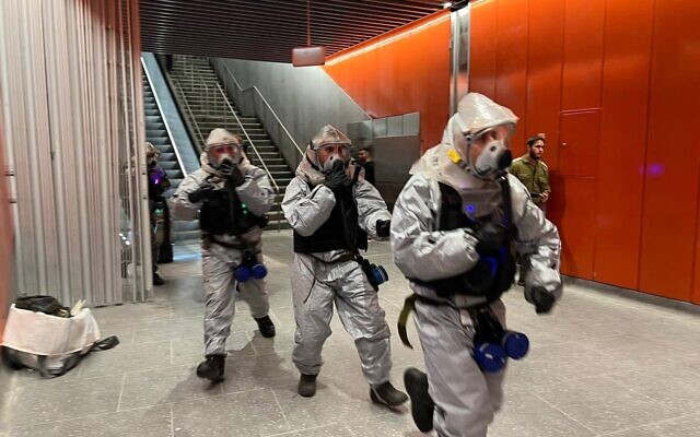 Security forces hold a drill simulating a chemical terror attack at the Allenby light rail station in Tel Aviv, on November 22, 2022. (Defense Ministry)