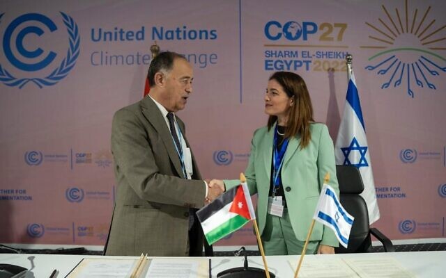 Jordanian Minister of Water and Irrigation, Mohammed Al Najer (left) shakes hands with Israel’s outgoing Minister of Environmental Protection, Tamar Zandberg, after signing an agreement to restore the Jordan River at the UN COP27 climate conference in Sharm el-Sheikh, Egypt. (Bradley D’coutho)