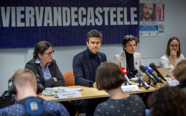 Belgian lawyer Chloe Georgiev (L), Olivier's sister Nathalie Vandecasteele (2nd L), legal adviser Olivier Van Steirtegem (2nd R) and lawyer Olivia Venet (R), hold a press conference on December 9, 2022 in Brussels, on aid worker Olivier Vandecasteele, 41, who launched a hunger strike over the "inhuman" treatment by his captors, as he is detained in Iran since February.  (Photo by NICOLAS MAETERLINCK / BELGA / AFP)