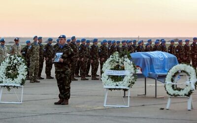 UNIFIL peacekeepers attend a repatriation ceremony for Irish soldier Sean Rooney who was killed on a UN patrol, at Beirut international airport on December 18, 2022. (Anwar Amro/AFP)