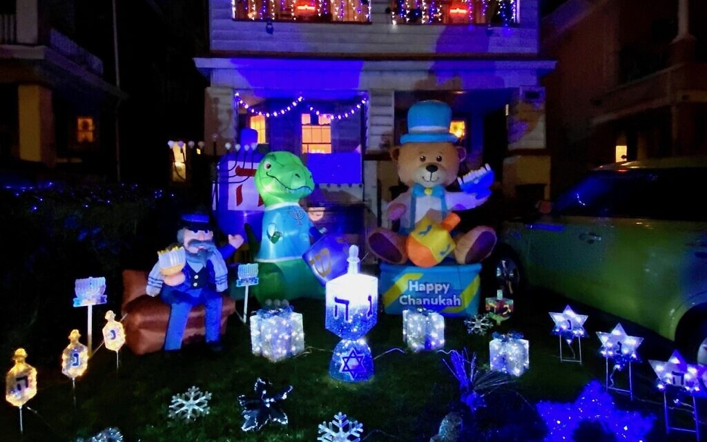 Gail Nalven Fuchs's Hanukkah House in the Midwood neighborhood of Brooklyn is decorated a week before the holiday and stays up a week after with lights, inflatables and other decor. (Courtesy via JTA)