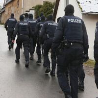 Police perform a raid on suspected members of the Reichsbürger far-right group in Saaldorf, Germany, December 7, 2022. (Bodo Schackow/picture alliance via Getty Images)