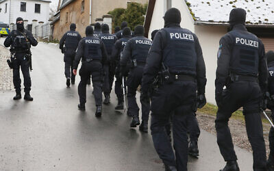 Police perform a raid on suspected members of the Reichsbürger far-right group in Saaldorf, Germany, December 7, 2022. (Bodo Schackow/picture alliance via Getty Images)