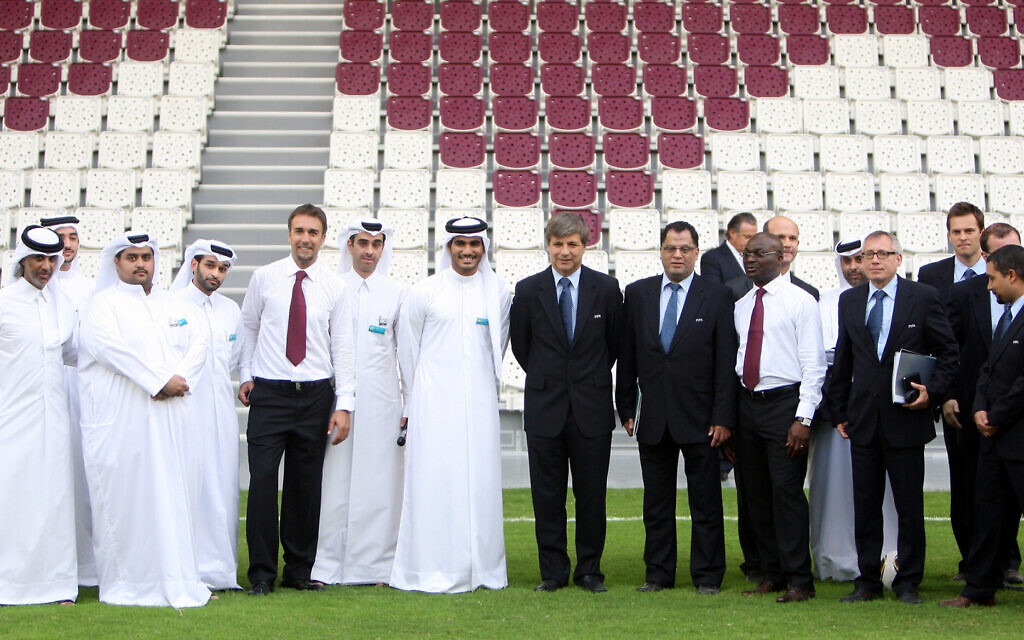 Members of the FIFA inspection group stand next to officials of the Qatar 2022 bid team as they visit a showcase stadium during the FIFA Inspection Visit for the Qatar 2022 World Cup Bid  in Doha, Qatar, September 14 2010. (AP Osama Faisal)