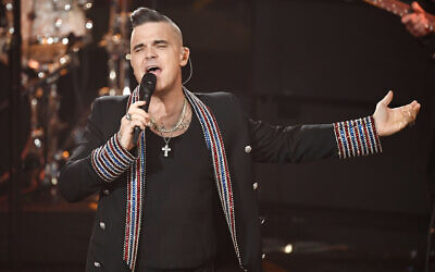 Singer Robbie Williams performs during a charity gala in Berlin, Germany, December 7, 2019. (Jens Meyer/AP)