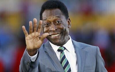 Brazilian soccer legend Pelé waves prior to the African Cup of Nations final soccer match between Ivory Coast and Zambia at Stade de L'Amitie in Libreville, Gabon, February 12, 2012. (AP/Francois Mori)