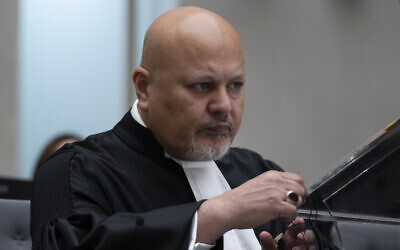 Public Prosecutor Karim Khan prepares for the trial of Mahamat Said Abdel Kani at the International Criminal Court in The Hague, Netherlands, September 26, 2022. (AP Photo/Peter Dejong, Pool)