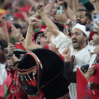 Morocco fans celebrate during the World Cup group F soccer match between Canada and Morocco at the Al Thumama Stadium in Doha , Qatar, December 1, 2022. (AP Photo/Natacha Pisarenko)