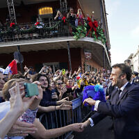 French President Emmanuel Macron greets the crowd in New Orleans, Dec. 2, 2022. (AP Photo/Gerald Herbert)