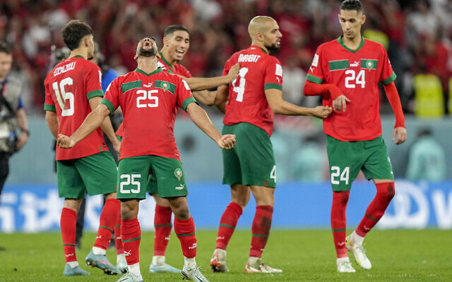 Morocco's players celebrate during a penalty shootout of the World Cup round of 16 soccer match between Morocco and Spain, at the Education City Stadium in Al Rayyan, Qatar, Tuesday, Dec. 6, 2022. (AP Photo/Martin Meissner)