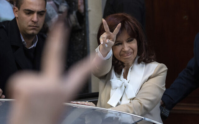 Argentine Vice President Cristina Fernandez greets supporters as she leaves her home in Buenos Aires, Argentina, Aug. 23, 2022. (AP Photo/Rodrigo Abd)