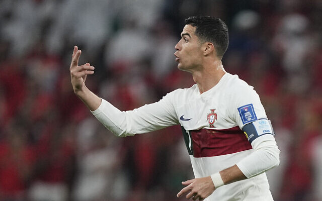 Portugal's Cristiano Ronaldo gestures after entering the pitch during the World Cup quarterfinal soccer match between Morocco and Portugal, at Al Thumama Stadium in Doha, Qatar, December 10, 2022. (AP/Martin Meissner)