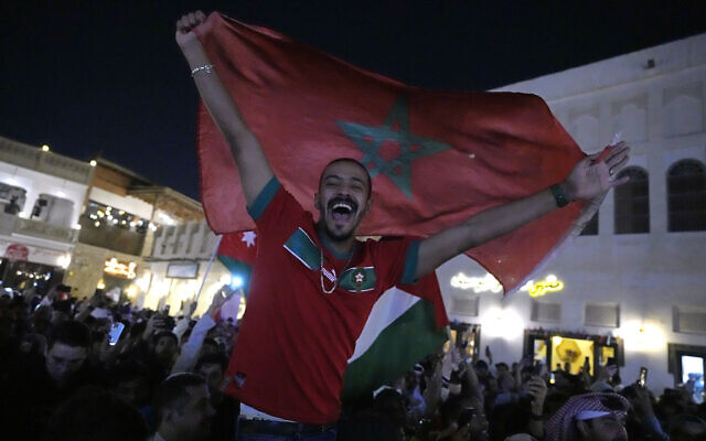 People celebrate in the Souq in Doha, Qatar after Morocco beat Portugal in a World Cup quarterfinal soccer match at Al Thumama Stadium in Doha, Qatar, December 10, 2022. (AP Photo/Jorge Saenz)