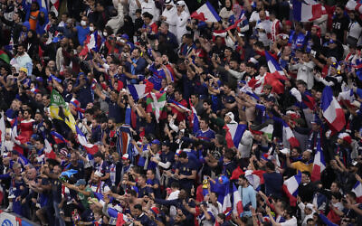 French fans celebrate their team's victory over Engand in their World Cup quarterfinal soccer match, at the Al Bayt Stadium in Al Khor, Qatar, Sunday, Dec. 11, 2022. (AP Photo/Darko Bandic)