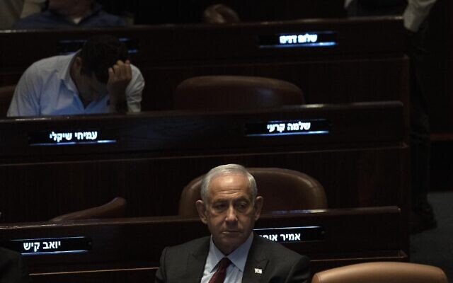 Prime minister designate Benjamin Netanyahu, center, at the Knesset, Israel's parliament, in Jerusalem, December 13, 2022.(AP Photo/ Maya Alleruzzo, File)