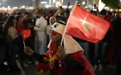 Fans of Morocco gather in Souq Waqif market prior to a World Cup semifinal soccer match between France and Morocco in Doha, Qatar, Dec. 14, 2022. (AP Photo/Andre Penner)
