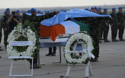 The coffin of UNIFIL Pvt. Seán Rooney at his memorial procession at the Lebanese army airbase, at Beirut airport, December 18, 2022. (AP Photo/Hussein Malla)