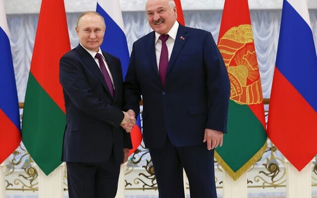 Russian President Vladimir Putin and Belarusian President Alexander Lukashenko pose for photo prior to their talks in Minsk, Belarus, December 19, 2022. (Konstantin Zavrazhin, Sputnik, Kremlin Pool Photo via AP)
