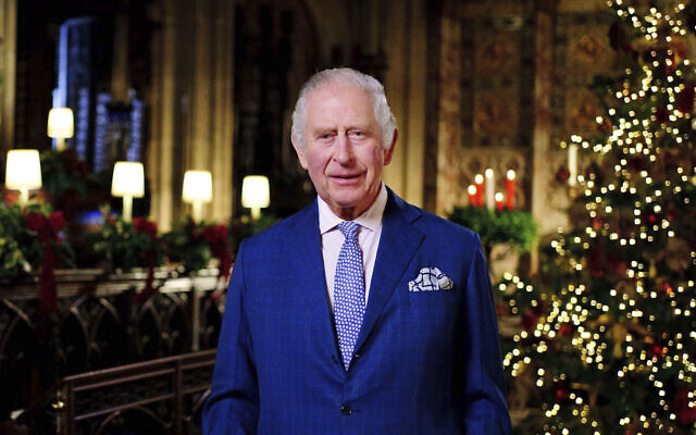 Britain's King Charles III delivers his message during the recording of his first Christmas broadcast in the Quire of St George's Chapel at Windsor Castle, Berkshire, England, Dec. 13, 2022. (Victoria Jones/Pool Photo via AP)