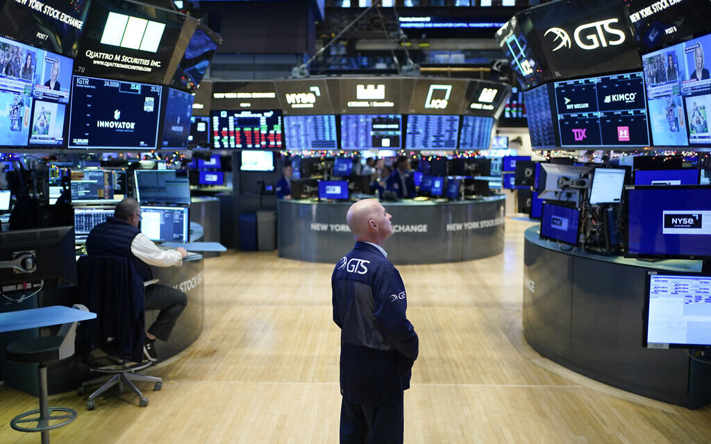 Traders work on the floor at the New York Stock Exchange in New York, December 29, 2022. (AP Photo/Seth Wenig)