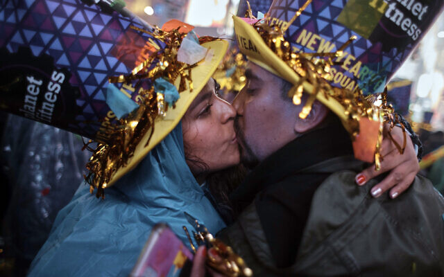 Revellers kiss during the New Year's Eve celebrations in Times Square on Jan. 1, 2023, in New York. (AP Photo/Andres Kudacki)