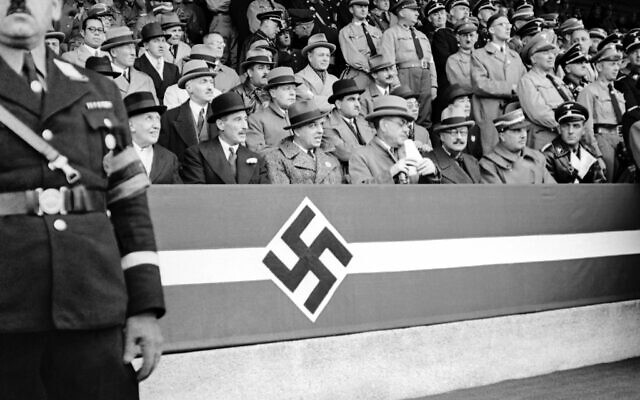 Adolf Hitler made a speech to 48,000 boys and 5,000 girls at the Nazi party congress in Nuremberg, Germany on September 11, 1937 during a parade attended by foreign diplomats. From left to right in front row: Antonio Marquis De Magaz, Spain's envoy to Germany, Sir Neville Henderson, British Ambassador, unknown, Signor Attolico, Italian Ambassador, Andre Francois-Poncet, French Ambassador, Vicco Von Buelow Schwante, chief of protocol in the German Foreign Office. (AP)