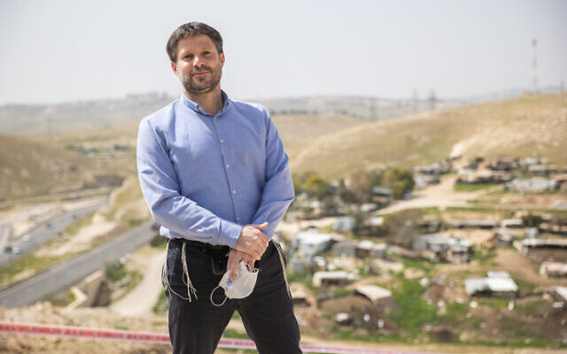 Religious Zionism leader MK Bezalel Smotrich standing above the Khan al-Ahmar Bedouin encampment in the West Bank on March 21, 2021. (Yonatan Sindel/Flash90)