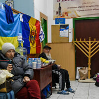 Jewish Ukrainian who fled war zones in Ukraine wait to receive their entry papers to Israel, at an emergency shelter in Chisinau, Moldova, March 15, 2022. (Yossi Zeliger/Flash90)