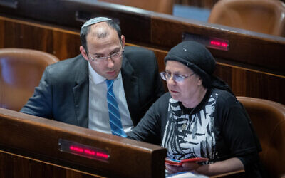MK's Simcha Rotman and Orit Strock in the opening of the Knesset summer session at the assembly hall of the Knesset, the Israeli parliament in Jerusalem on May 9, 2022. (Yonatan Sindel/Flash90)