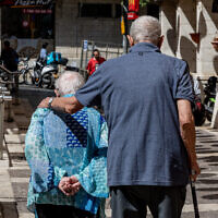 Illustrative: Elderly people walk together in downtown Jerusalem, September 11, 2022. (Nati Shohat/Flash90)