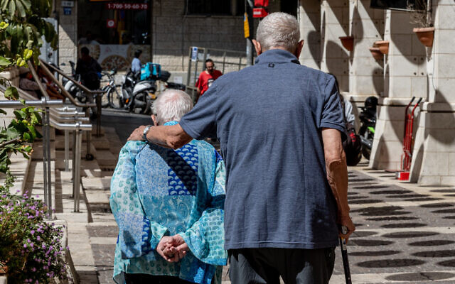 Illustrative: Elderly people walk together in downtown Jerusalem, September 11, 2022 (Nati Shohat/Flash90)