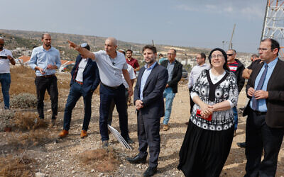 Religious Zionism party chief Betzalel Smotrich (center) and party members at the settlement of Efrat in the West Bank, October 26, 2022. (Gershon Elinson/Flash90)