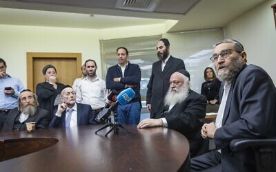 MK Moshe Gafni, right, speaks at a meeting of the United Torah Judaism faction at the Knesset on December 5, 2022. (Olivier Fitoussi/Flash90)