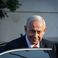 Likud head MK Benjamin Netanyahu seen after coalition talks outside a hotel in Jerusalem, December 5, 2022. (Yonatan Sindel/Flash90)