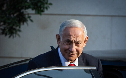 Likud head MK Benjamin Netanyahu seen after coalition talks outside a hotel in Jerusalem, December 5, 2022. (Yonatan Sindel/Flash90)