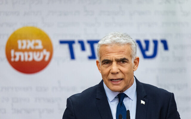 Prime Minister Yair Lapid speaks during a Yesh Atid faction meeting at the Knesset in Jerusalem, December 12, 2022. (Yonatan Sindel/Flash90)