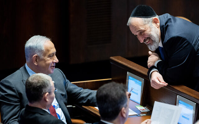 Shas leader Aryeh Deri (R) speaks with Likud chief Benjamin Netanyahu (top L) and Likud MK Yariv Levin (bottom L), during Levin's election as Knesset speaker, December 13, 2022. (Yonatan Sindel/Flash90)