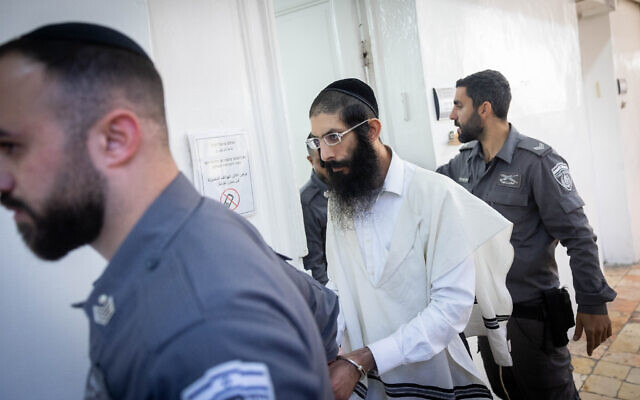 Yehoshua Dadon seen following a hearing at the Jerusalem Magistrate's Court, days before being indicted over a fire that destroyed a cell phone store in the Geula neighborhood in Jerusalem, December 18, 2022. (Yonatan Sindel/Flash90)