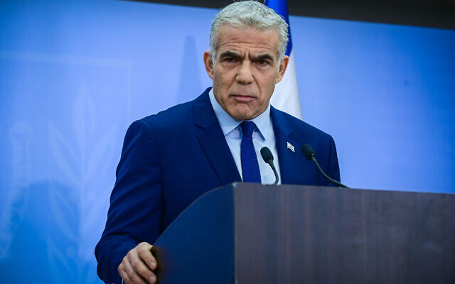 Prime Minister Yair Lapid holds a press conference in Tel Aviv on December 22, 2022, at which he castigated the incoming coalition as dangerous to Israel. (Tomer Neuberg/Flash90)