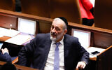 Shas party leader MK Aryeh Deri seen during a vote in the Knesset, in Jerusalem, on December 28, 2022. (Olivier Fitoussi/Flash90)