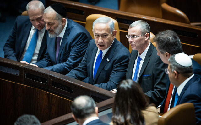 (left to right) Yoav Gallant, Aryeh Deri, Benjamin Netanyahu, Yariv Levin and others during a Knesset plenum session on forming the government, in Jerusalem, December 29, 2022. (Yonatan Sindel/Flash90)