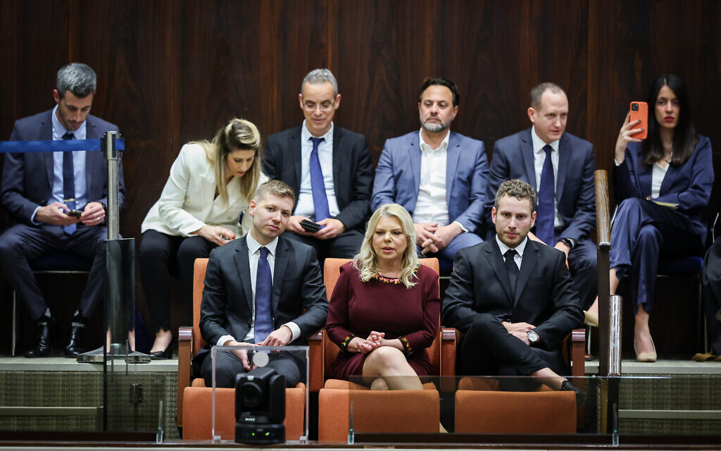 (L-R) Yair, Sara and Avner Netanyahu at a Knesset plenum session on forming Benjamin Netanyahu's new government, in Jerusalem, December 29, 2022. (Yonatan Sindel/FLASH90)