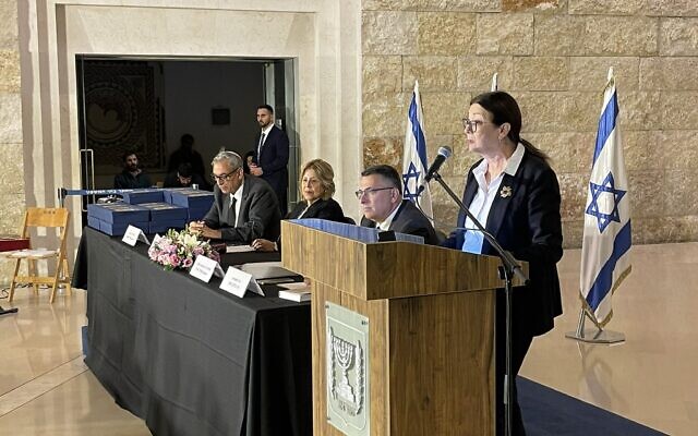 This handout photo shows Suprme Court President Esther Hayut, right, and Justice Minister Gideon Sa'ar, second right, at a ceremony on December 6, 2022. (Israeli Judicial Authority)